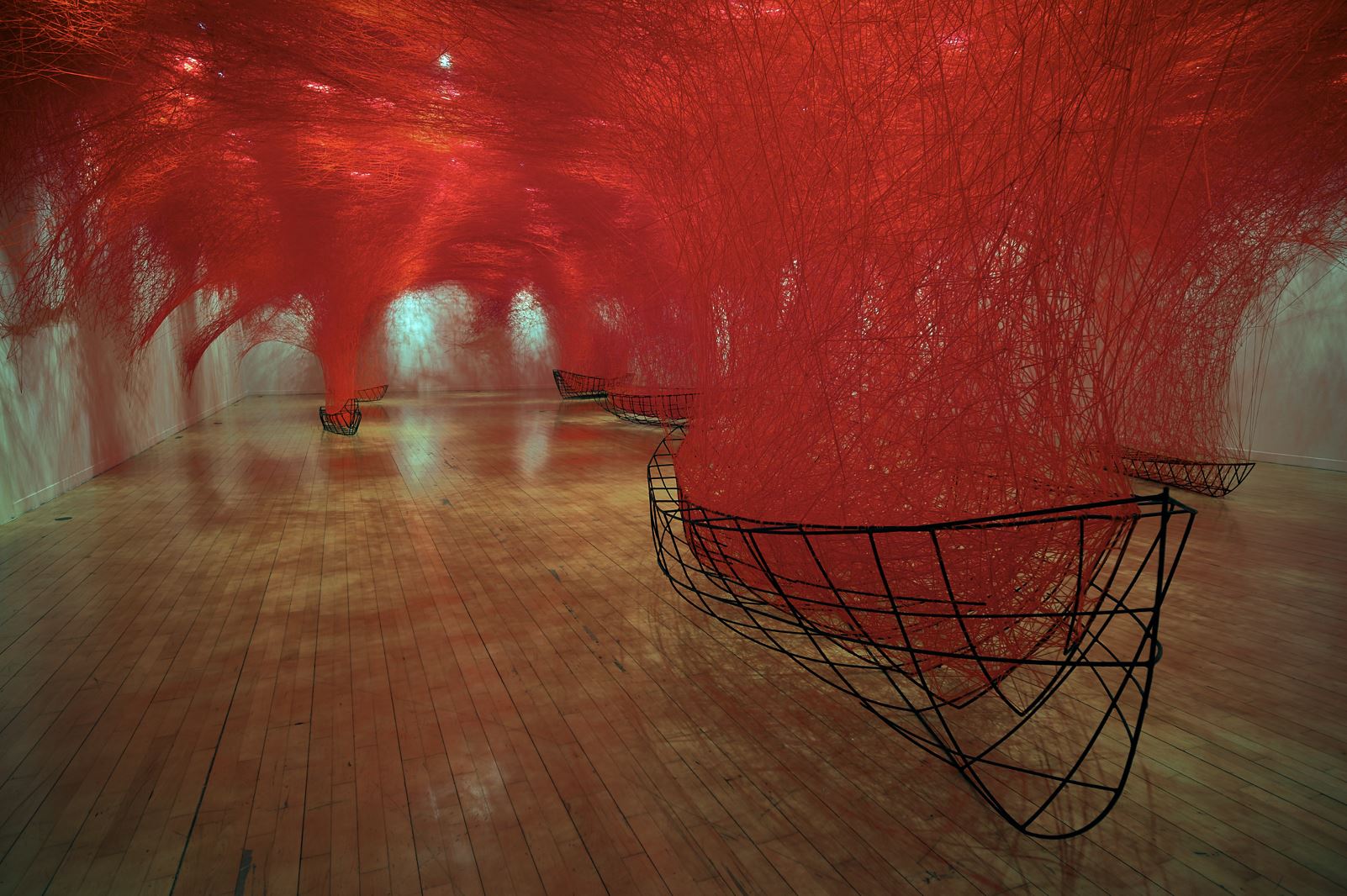 ‘Uncertain Journey’ by Chiharu Shiota. Installation: metal frame, red wool. Busan Museum of Art, Busan, South Korea. 2019. Photo by Sunhi Mang. © DACS, London, and the artist, 2024. Permission to use photo granted from DACS, London.