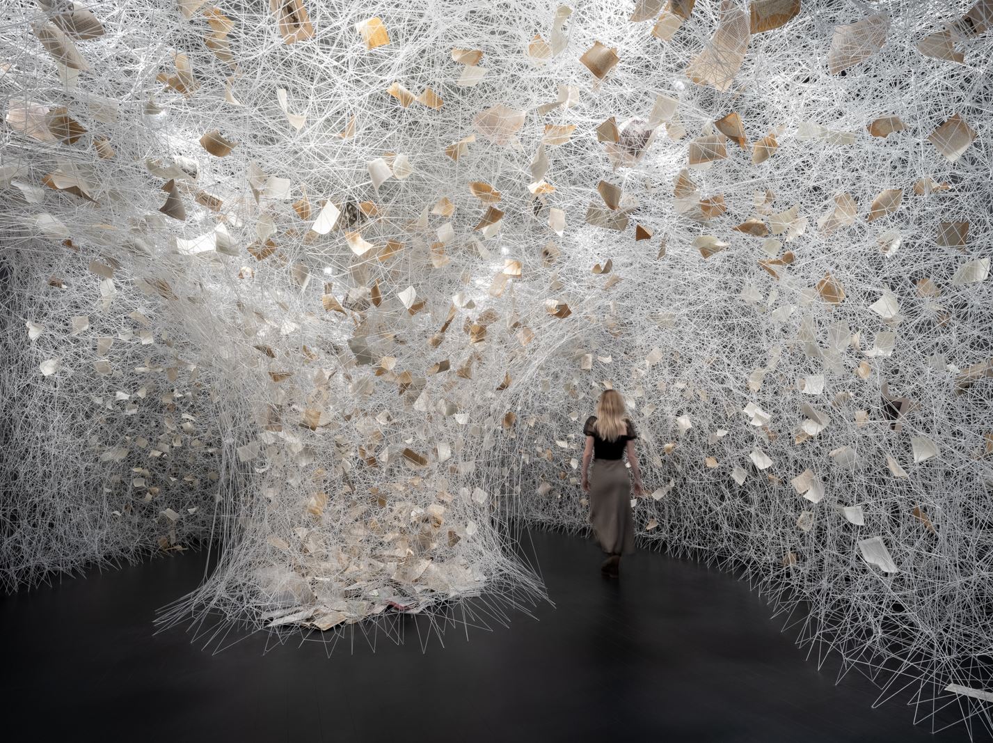 ‘Human Rhizome’ by Chiharu Shiota. Installation: book, wool. Galerie Templon, New York, USA. 2023. Photo by Charles Roussel. © DACS, London, and the artist, 2024. Permission to use photo granted from DACS, London.