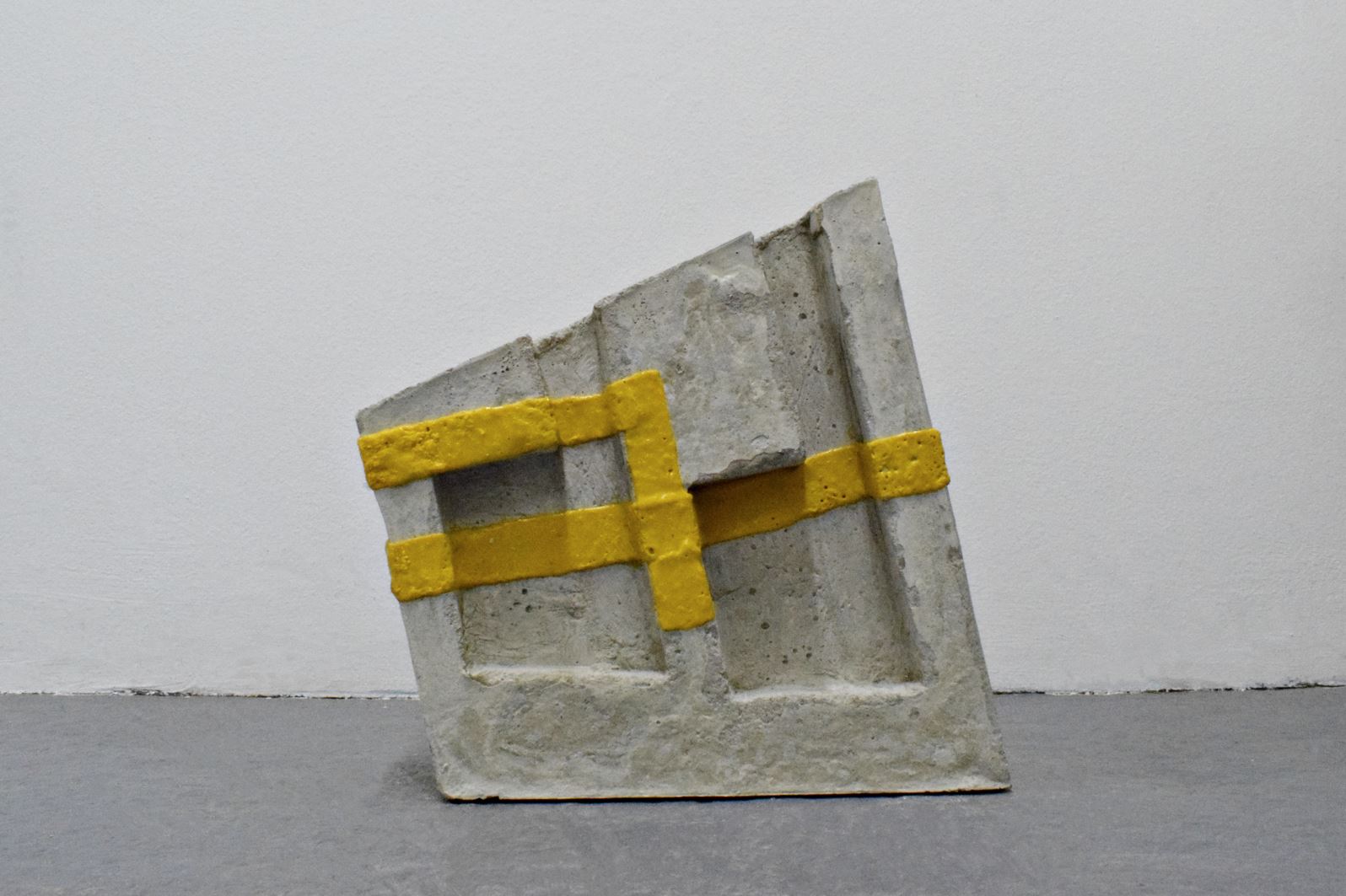 ‘Urban Code’, sculpture by Rabia Raja. Concrete and thermoplastic tape. 32cm x 30cm x 8cm. 2024.