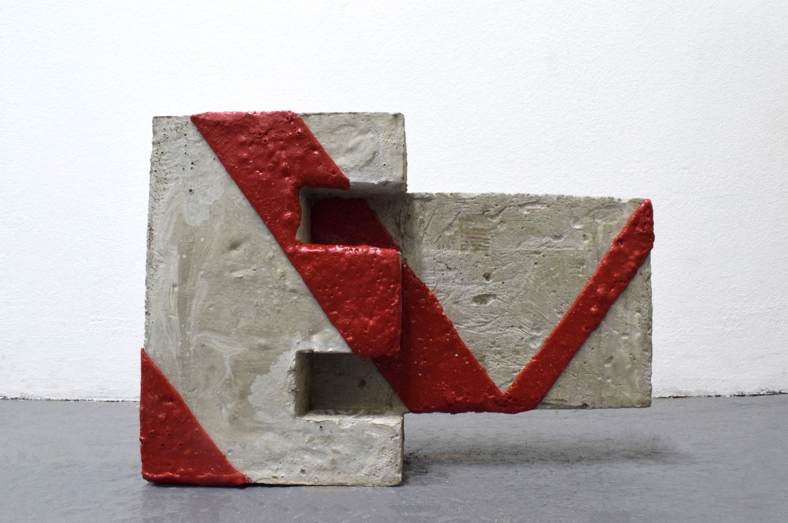 ‘Urban Code’, sculpture by Rabia Raja. Concrete and thermoplastic tape. 35cm x 20cm x 8cm. 2024.